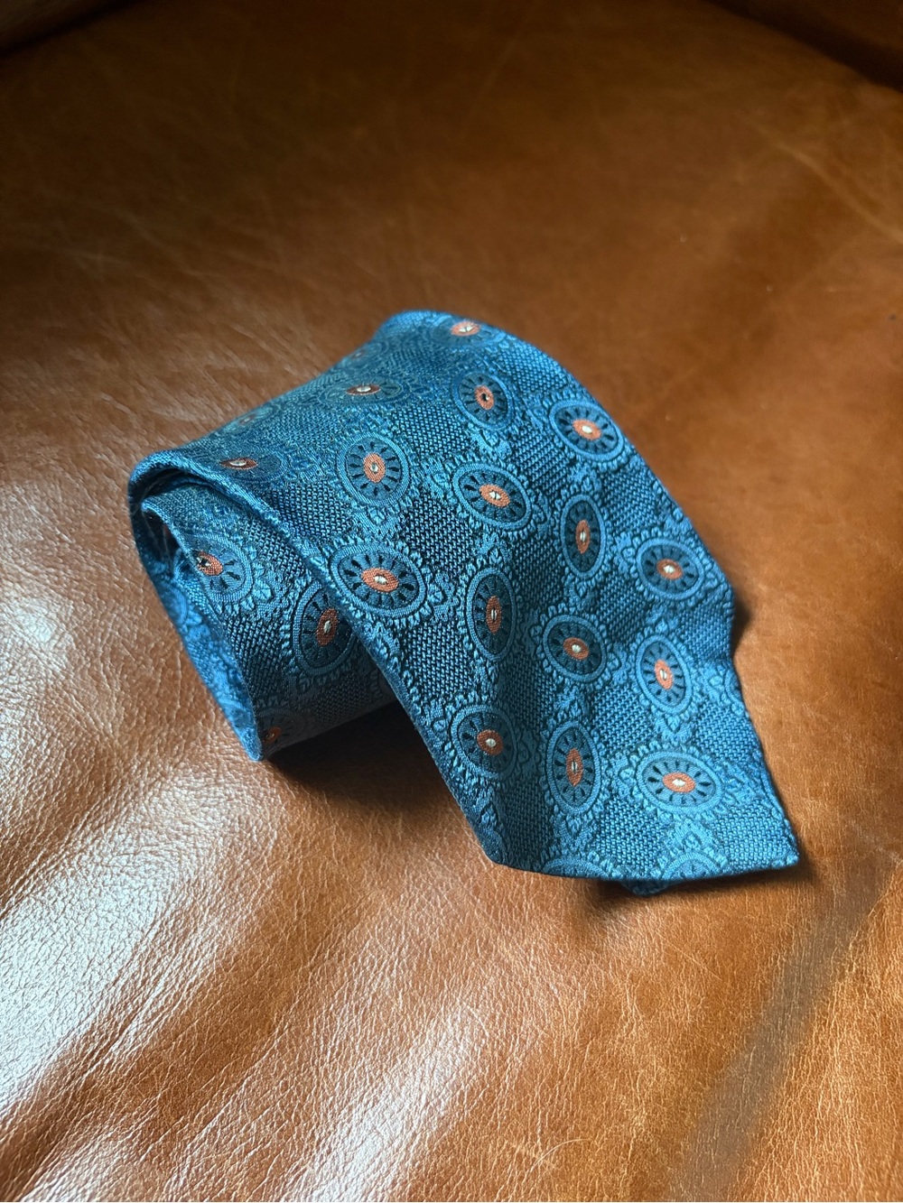 CHANEL Midnight Blue Silk Tie with Circular Terracota Medallion Motif